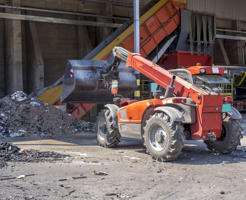 loader-transporting-soil-waste-materials-waste-treatment-plant-scaled.jpg